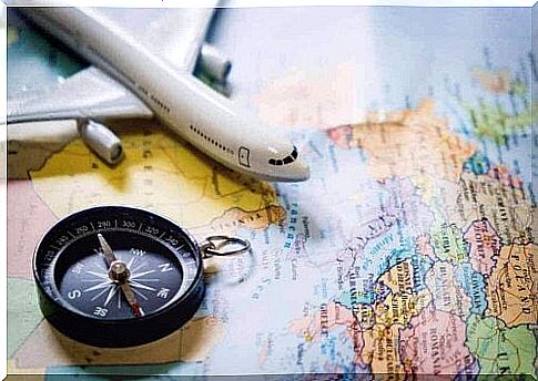 A compass, a toy plane and a world map