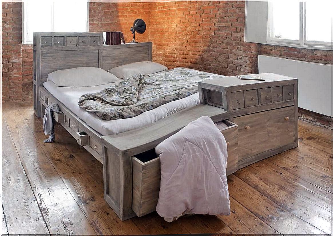 Bed in room with brick walls