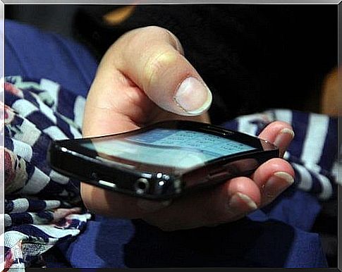 Person sitting with a mobile