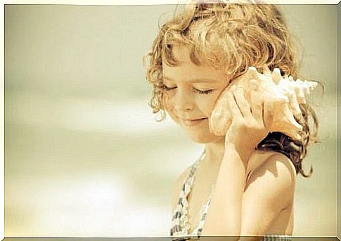 Children listening to conch