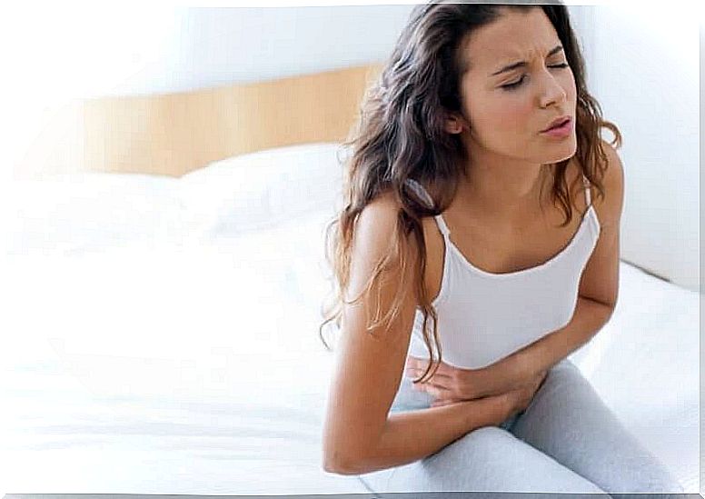 Woman with abdominal pain - causes of back pain