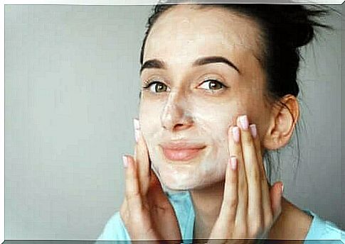 Woman applying face cream with peptides