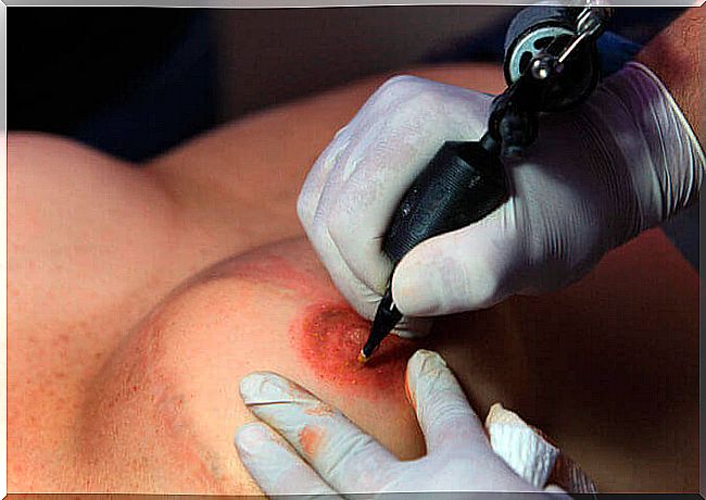 Woman getting tattooed new nipple