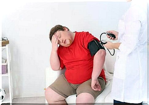 Man gets blood pressure measured by doctor