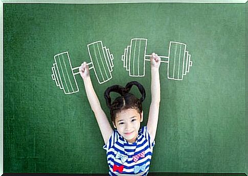 Girl with drawing of dumbbells over her