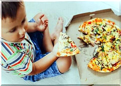 Boy eating pizza