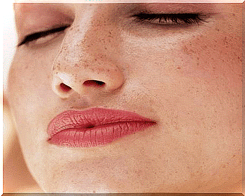 Woman with freckles on face