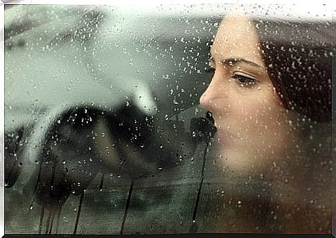 Woman looking out through a car window