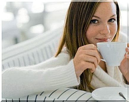 Young woman drinking tea