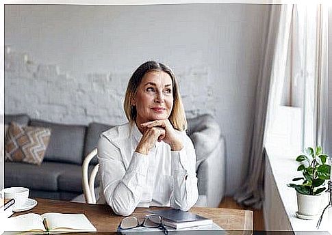 Smiling woman thinking about creating a habit