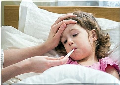 Little girl gets her temperature measured 