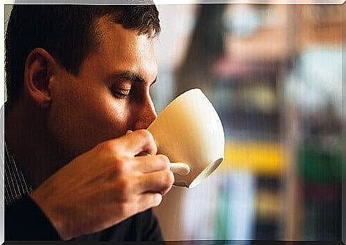 Man drinking a cup of coffee