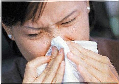 Woman brushing nose