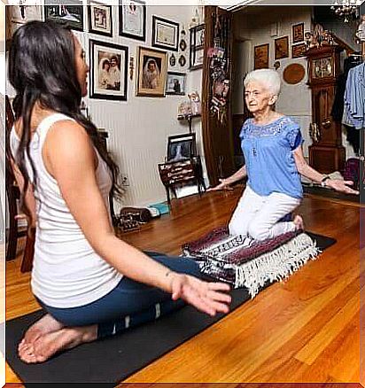 Elderly woman practicing yoga