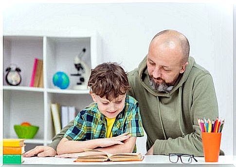 Father reads with son to create habits in children