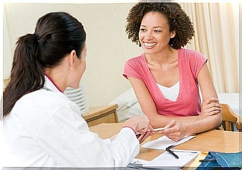 Woman smiling at doctor