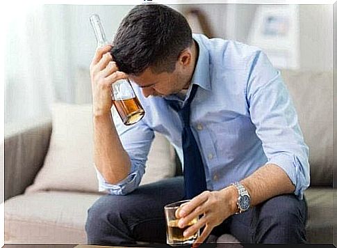 Man with liquor bottle is dirty due to consuming alcohol on an empty stomach