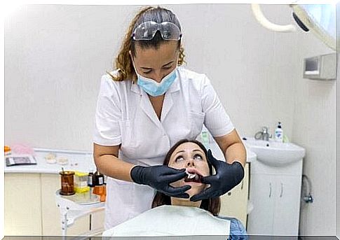 Dentist treats patient with gum smile